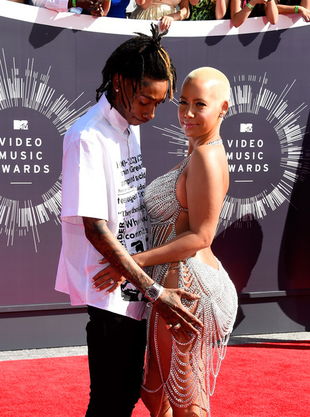 Guess its final Amber Rose removes Wiz Khalifa tattoo from her arm  photos